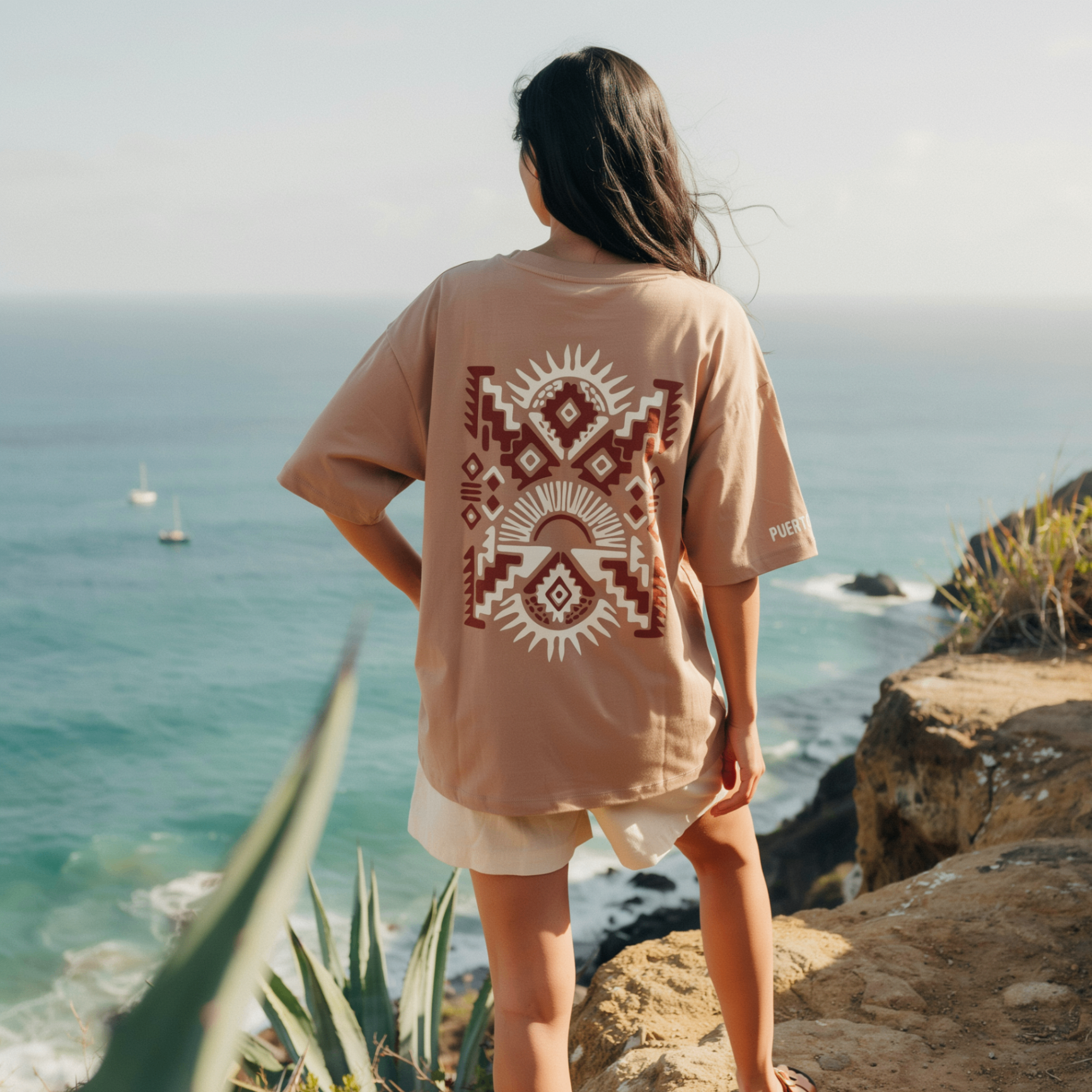 Tribal terracotta tee — sun back print